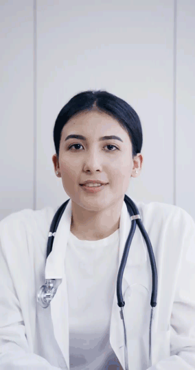 A female doctor with a stethoscope around her neck, looking directly at the camera as if in a video call.